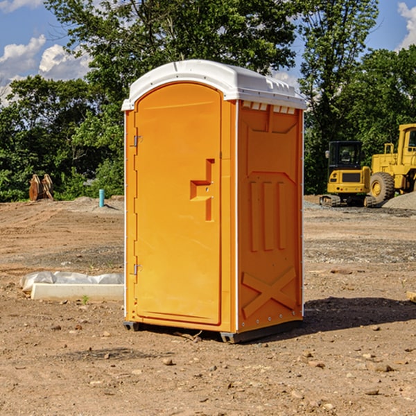 what is the cost difference between standard and deluxe portable restroom rentals in Gilchrist County